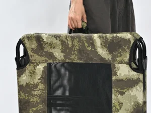 Portable outdoor dog bed with integrated carry handle for camping brands, travel collections and private label programs