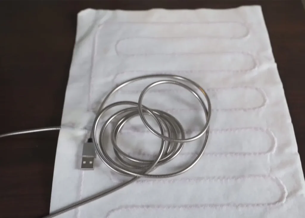 Portable charging bank connection layout for travel-ready cordless electric cat warming mat merchandising.