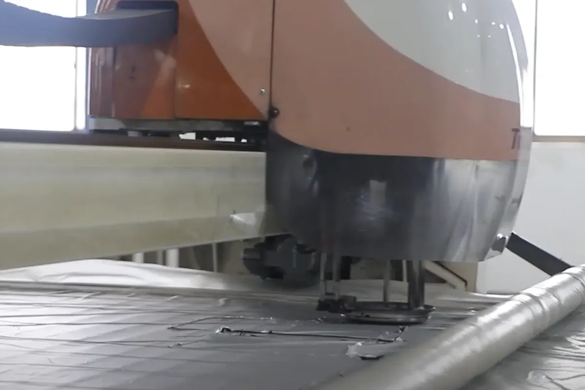 Automated fabric cutting machine for donut dog bed production with CAD layout optimization