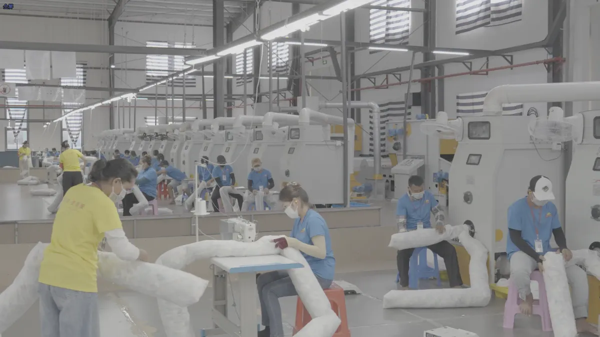 Fiber filling process for dog bed cushions at our Cambodia factory